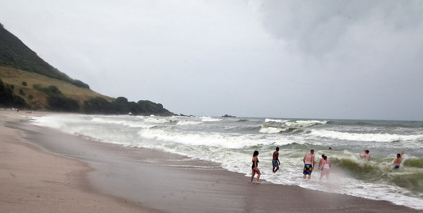 Wet Weather at the Mount. These Aucklanders decided to take a dip at the Mount Main Beach despite the rain. Photo/Andrew Warner.