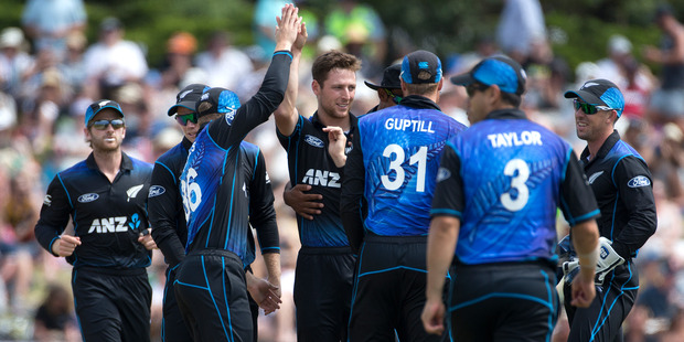 Matt Henry is congratulated by fellow Black Caps after getting the wicket of Sri Lankan batsman, Lahiru Thirimanne. Photo / Alan Gibson