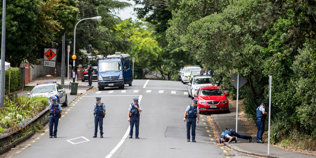 Police teams search for clues after an earlier incident on Shore Road Remuera after the body of a female jogger was found. Photo / Michael Craig