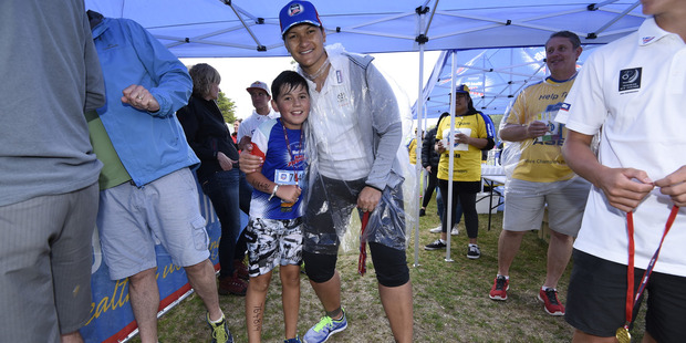 Lucah Lockhart, 10 of Greenpark School with Valerie Adams. Photo/George Novak