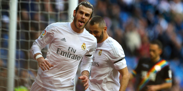 Gareth Bale celebrates after scoring his side's fourth goal against Rayo Vallecano. Photo / AP