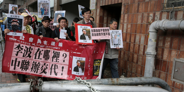 Protesters calling for the release of Lee Bo and his colleagues have taken to the streets of Hong Kong. Photo / AP