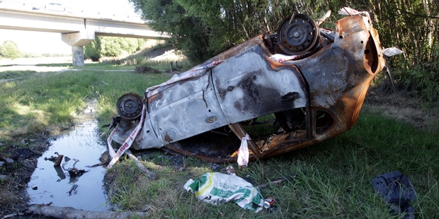 A burnt-out car has been left at a popular summer swimming spot. Photo / Paul Taylor