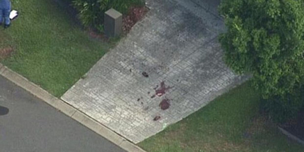 Blood seen on the drive outside a house on the street. Photo / 9 News