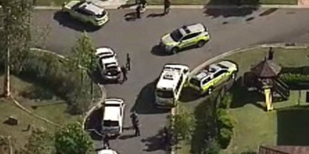 Police and ambulance vehicles clustered near the scene of the attack. Photo / 9 News