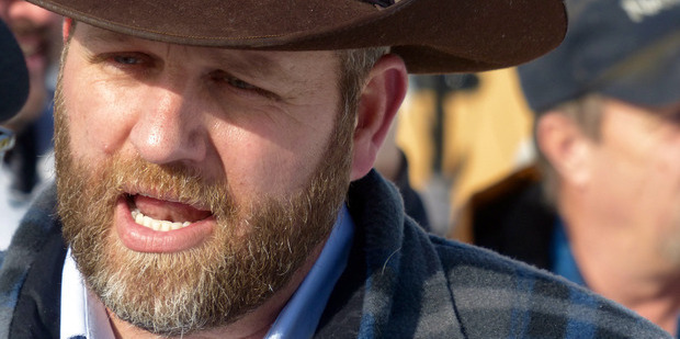 Ammon Bundy chats with a protester during a march on behalf of a Harney County ranching family in Burns, Oregon. Photo / AP
