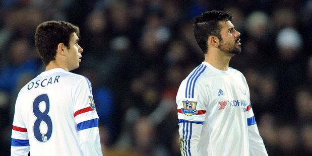 Chelsea's Diego Costa, right, and Oscar react during an English Premier League defeat. Photo / Ap