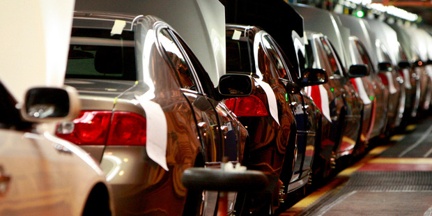 General Motors Co. Cadillac DTS and Buick Lucerne sedans make their way down the assembly line at the General Motors plant in Detroit, US. Photo / Bloomberg