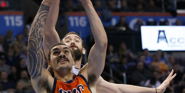 Oklahoma City Thunder center Steven Adams shoots in front of Memphis Grizzlies center Marc Gasol. Photo / AP