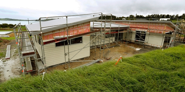 SHAPING UP: The home of Brian and Salley McEldowney (right) being built.PHOTO/MICHAEL CUNNINGHAM