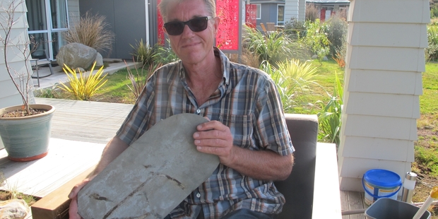 TANGIWAI MEMORIES: Carel Sietse with a steel step from one of the carriages which plunged into the Whangaehu River.PHOTO/LIN FERGUSON