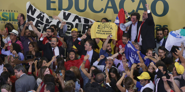 Supporters of Brazil's President Dilma Rousseff fill the lobby of Planalto presidential palace in Brasilia. Photo / AP