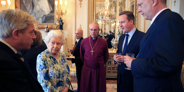 The Queen speaks to Prime Minister David Cameron, second right, as leader of the House of Commons Chris Grayling, right, and Archbishop of Canterbury Justin Welby, look on. Photo / AP
