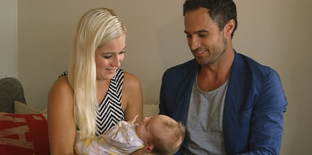 Jordan with a baby (not his) and Fleur Verhoeven, one of the finalists on The Bachelor NZ. Photo/TV3