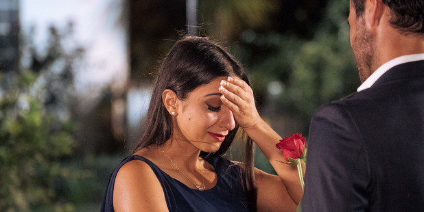 Naz gets a rose from Mauger in an earlier episode of The Bachelor NZ.