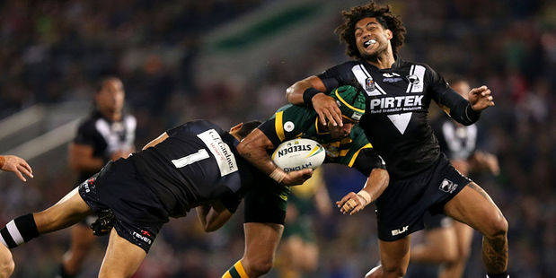 Adam Blair (right) tackles Jonathan Thurston. Photo / Getty