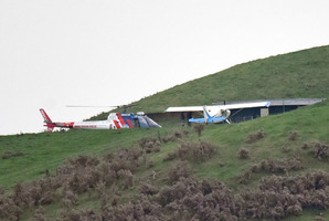 The Rotorua-based BayTrust Rescue Helicopter landed next to a second plane which was flying with the crashed aircraft. Photo/George Novak