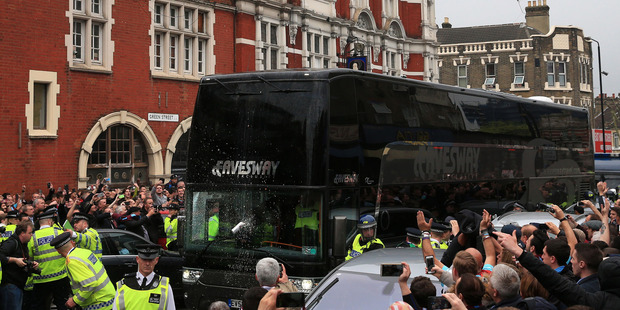 Riot police were on hand when the Manchester United team arrived at Upton Park. Photo / AP