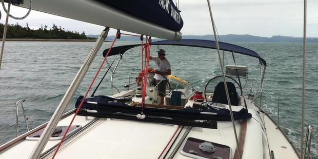 Nick the captain, helming the yacht in the Whitsundays. Photo / Lydia Jenkins