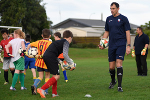 Coach James Bannatyne gives some goalkeeping tips. Photo/George Novak