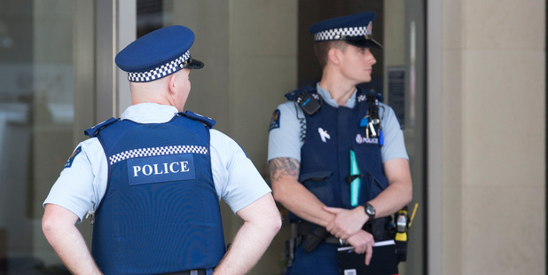 Police outside the Auckland Harbour Oaks Hotel in December 2015 after a woman was shot in the leg. Photo / Greg Bowker