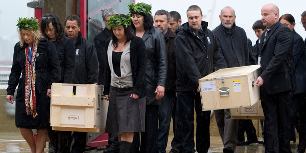 Boxes containing koiwi tangata (skeletal remains) of 33 Maori are carried onto Te Papa's Rongomaraeroa Marae during a repatriation powhiri, Wellington in 2009. Photo / Mark Mitchell