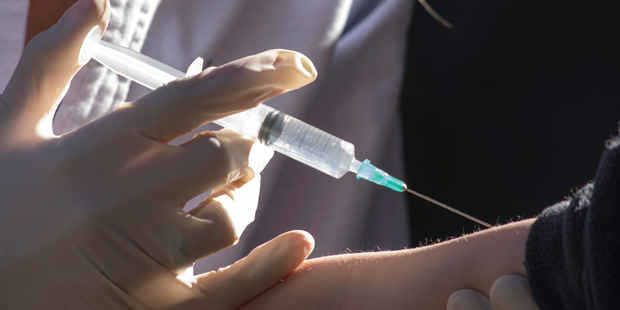 A doctor gives a child a measles vaccination. Photo / iStock