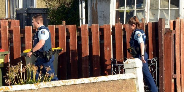 Police officers attend the scene of a Dunedin dog attack yesterday. Photo by Stephen Jaquiery / ODT