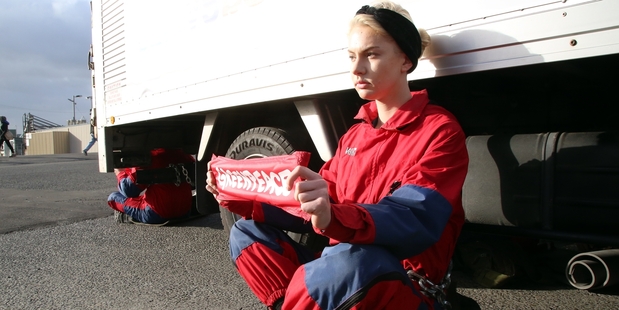 SITTING TIGHT: Protester Alex Green chained herself to a truck.