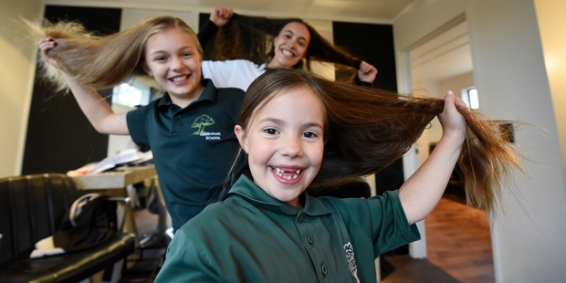 (Front to back) Sadie, 6, Ella Rose, 11, and Mikayla Carter-Hall, 16, before the cut. Photo / George Novak
