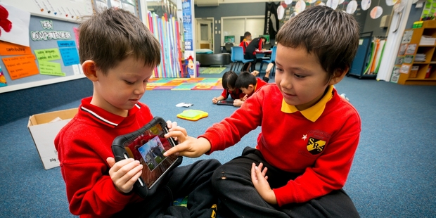 Jordan Coleman and Kauri Ngahungahu, both 6, use iPads at Stanhope Rd School. Photo / Dean Purcell