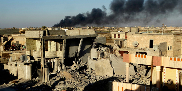 Smoke rises from Isis (Islamic State) positions after an airstrike in the Iraqi city of Ramadi. Photo / AP