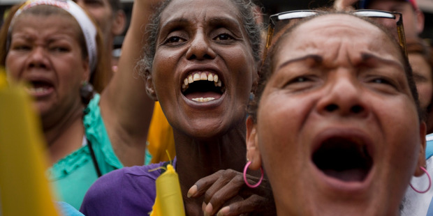 Women chant against the government of President Nicolas Maduro during a march in Caracas, Venezuela. Photo / AP