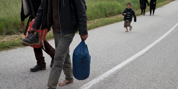 Migrants walk to Idomeni camp, Greece. Photo / AP