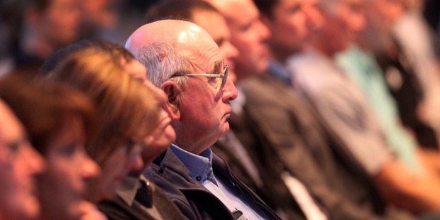 Farmers listen in silence to speakers at the Fonterra annual meeting held at Waitoa in the Waikato. Photo / File