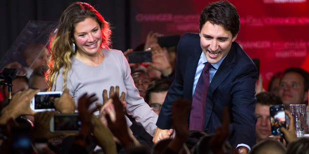 Justin Trudeau, Canada's Prime Minister and his wife Sophie Gregoire-Trudeau greet supporters on election night. Photo / AP