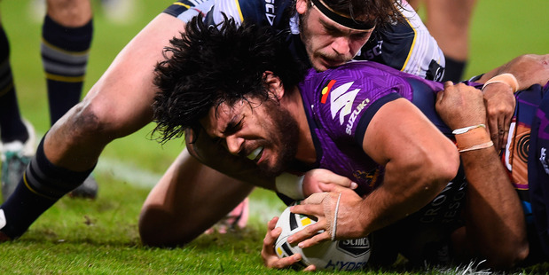 Tohu Harris crashes over for a try for the Melbourne Storm during their tight win against the North Queensland Cowboys last night. Photo / Getty Images