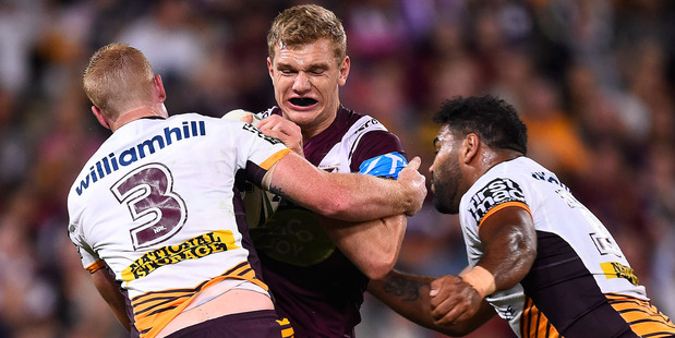 Tom Trbojevic of the Sea Eagles is tackled by Jack Reed and Sam Thaiday of the Broncos during Brisbane's 30-6 win last night. Photo / Getty Images