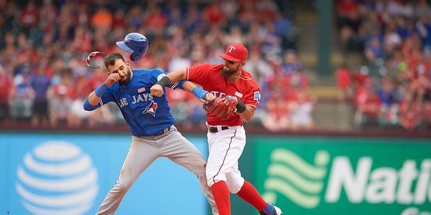 Texas Rangers Rougned Odor (R) landing punch vs Toronto Blue Jays Jose Bautista (L). Photo / Getty