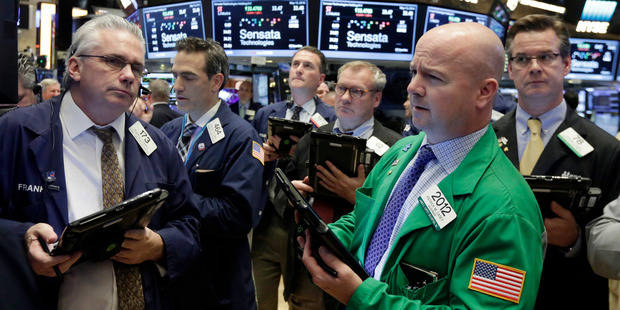 Traders gather at the New York Stock Exchange. File photo / AP