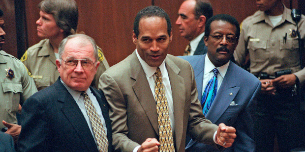 In this Oct. 3, 1995 file photo, O.J. Simpson, center, reacts as he is found not guilty of murdering his ex-wife Nicole Brown and her friend Ron Goldman. Photo: AP