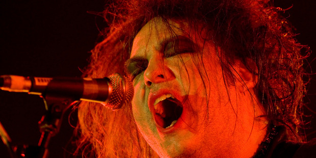 The Cure front man Robert Smith sings to a packed house at the Vector Arena Auckland. Photo / Richard Robinson