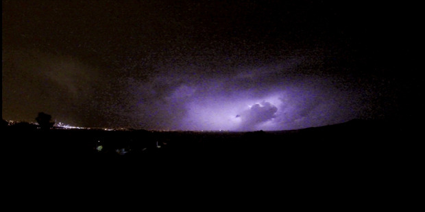 Lightning to north of Auckland at about 8pm on Monday. Photo: Matthew Davison