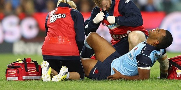Kurtley Beale suffers his knee injury that will sideline him for up to six months. Photo / Getty Images