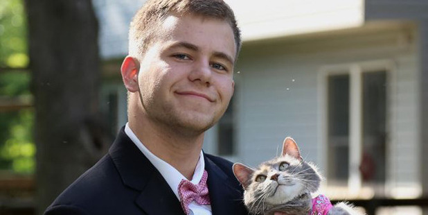 When he couldn't find a date, he enlisted the help of a four-legged friend. Photo / Imgur
