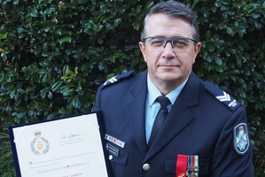 Senior Constable Shane Ashton has received a red ribbon for brave conduct.