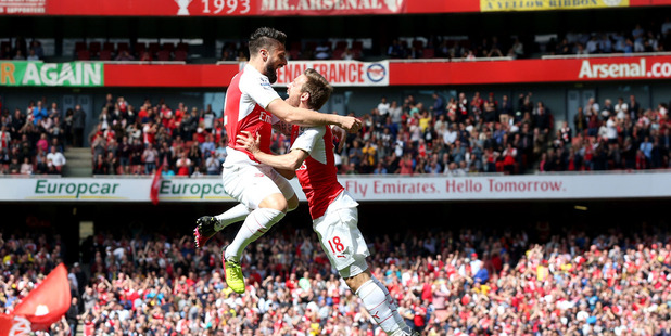 Arsenal's Olivier Giroud, left, celebrates with teammate Nacho Monreal after scoring their first goal. Photo / AP