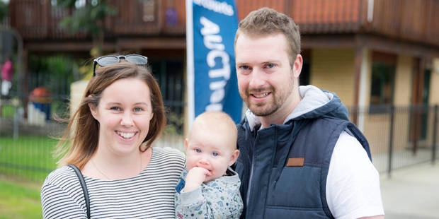 Home hunters Gemma Mann and Mike Alsweiler, with their son Harper, have not ruled out leaving Auckland to find a house they can afford. Picture / Michael Craig