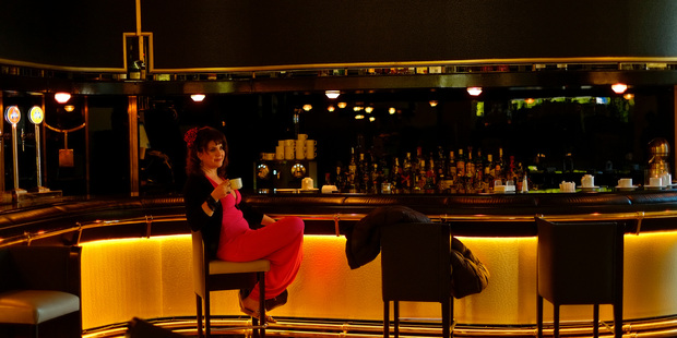A woman relaxes in the bar of a hotel, in Pamplona northern Spain. Photo / AP