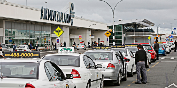 Taxis waiting outside the domestic terminal at Auckland International Airport. Photo / File